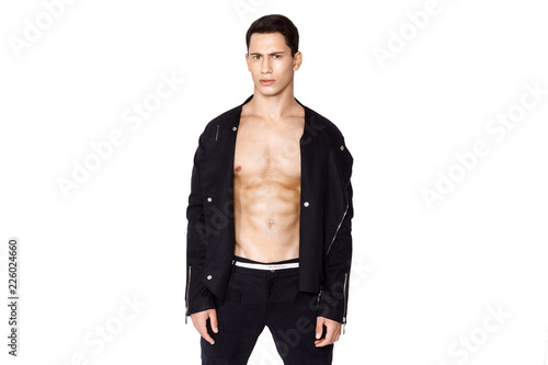 Strong muscle beautiful stripped male model in fashion cloathes on white isolated fontk background