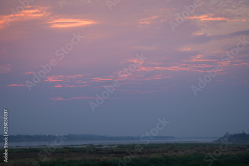 Mekong River, riverbank and beautiful colorful sky at sunset in Vientiane, Laos. Copy space. © tuomaslehtinen