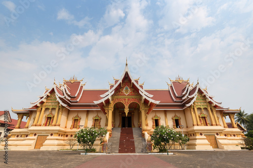 Hor Dhammasabha Buddhist convention hall of Wat That Luang Neau Temple in Vientiane  Laos  on a sunny day. Copy space.