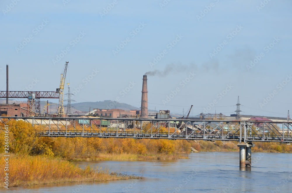 The funnel with smoke with bridge on foreground The funnel with smoke with bridge on foreground