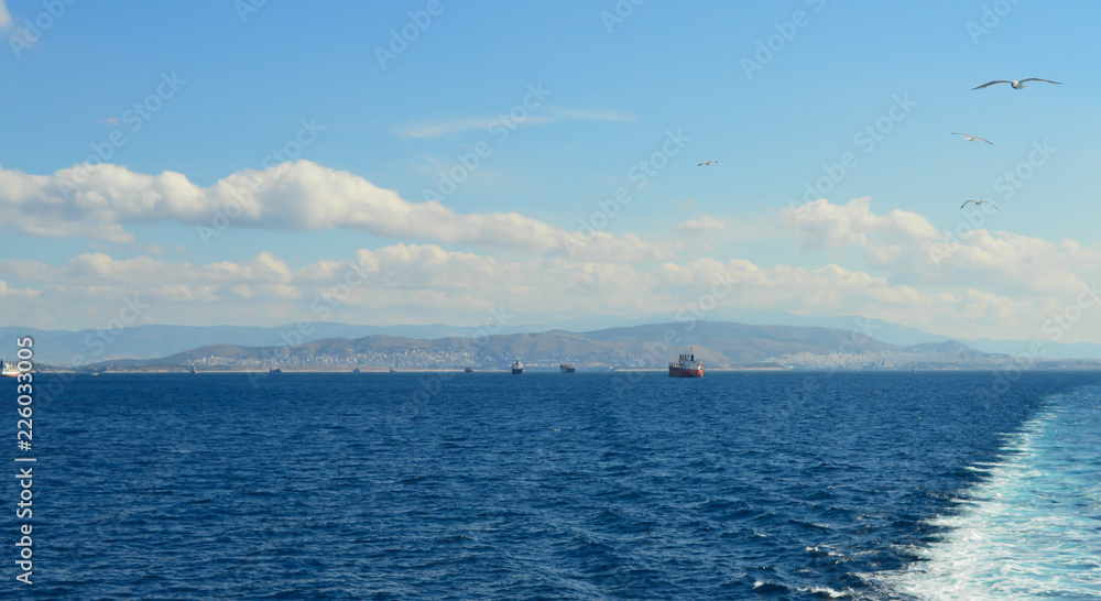 View from ferry in Saronic Gulf, Athens, Greece on June 19, 2017 View from ferry in Saronic Gulf, Athens, Greece on June 19, 2017