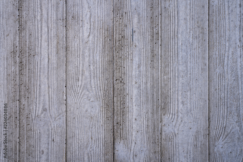 wood grain imprints in a concrete wall for backgrounds wood grain imprints in a concrete wall for backgrounds