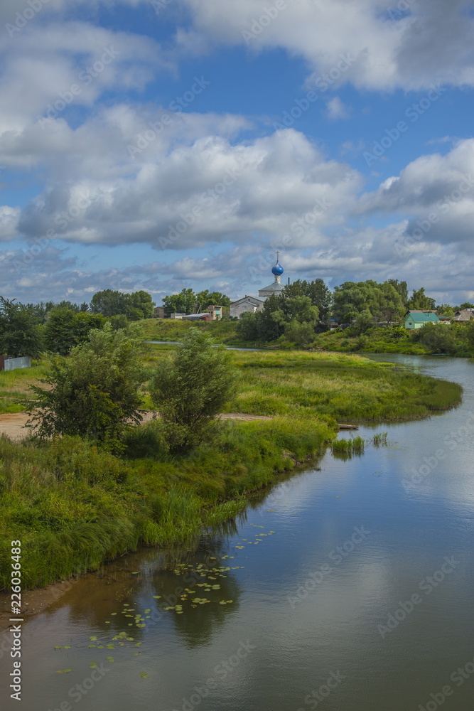 Clouds on a blue sky above the river