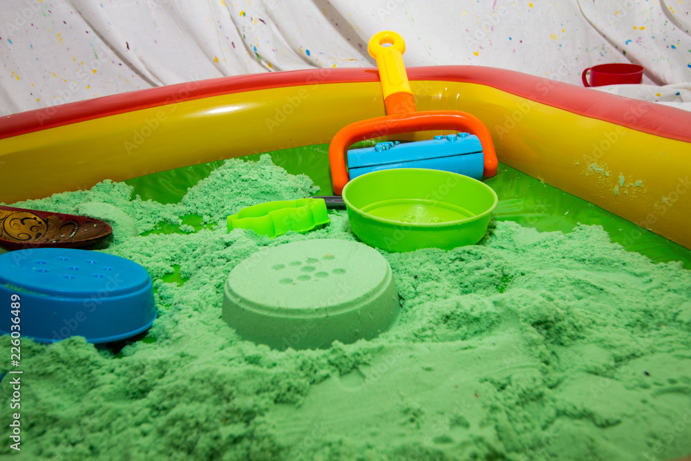 inflatable pool with kinetic sand and molds Stock Photo | Adobe Stock