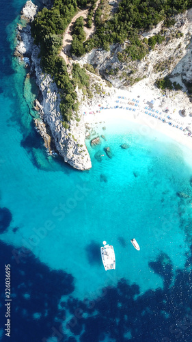 Aerial drone photo of iconic paradise sandy beach of Agiofili near port of Vasiliki with emerald crystal clear sea and sail boats docked, Lefkada island, Ionian, Greece