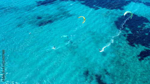 Fototapeta Naklejka Na Ścianę i Meble -  Aerial bird's eye view photo taken by drone of tropical white sandy beach with turquoise clear waters