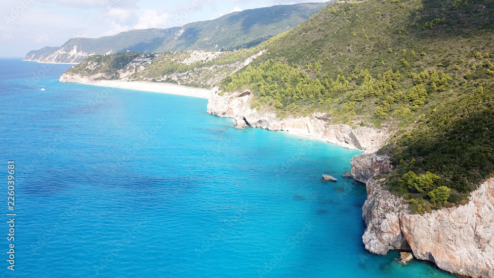 Aerial drone photo of iconic paradise beach of Kathisma with white rock steep cliff and emerald clear sea, Lefkada island, Ionian, Greece