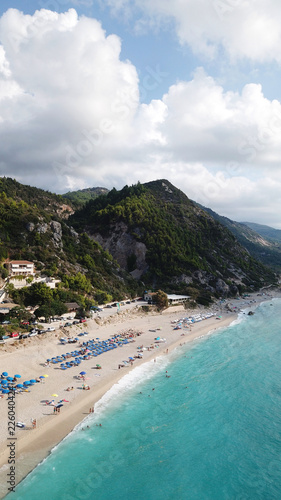 Fototapeta Naklejka Na Ścianę i Meble -  Aerial top view photo of sun beds in popular tropical paradise deep turquoise sandy beach of Kathisma, Lefkada island, Ionian, Greece