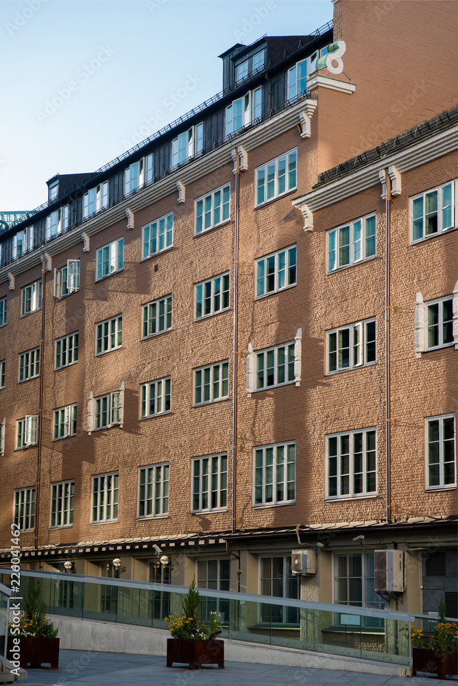 Fototapeta premium beautiful architecture and green plants on street in oslo, norway