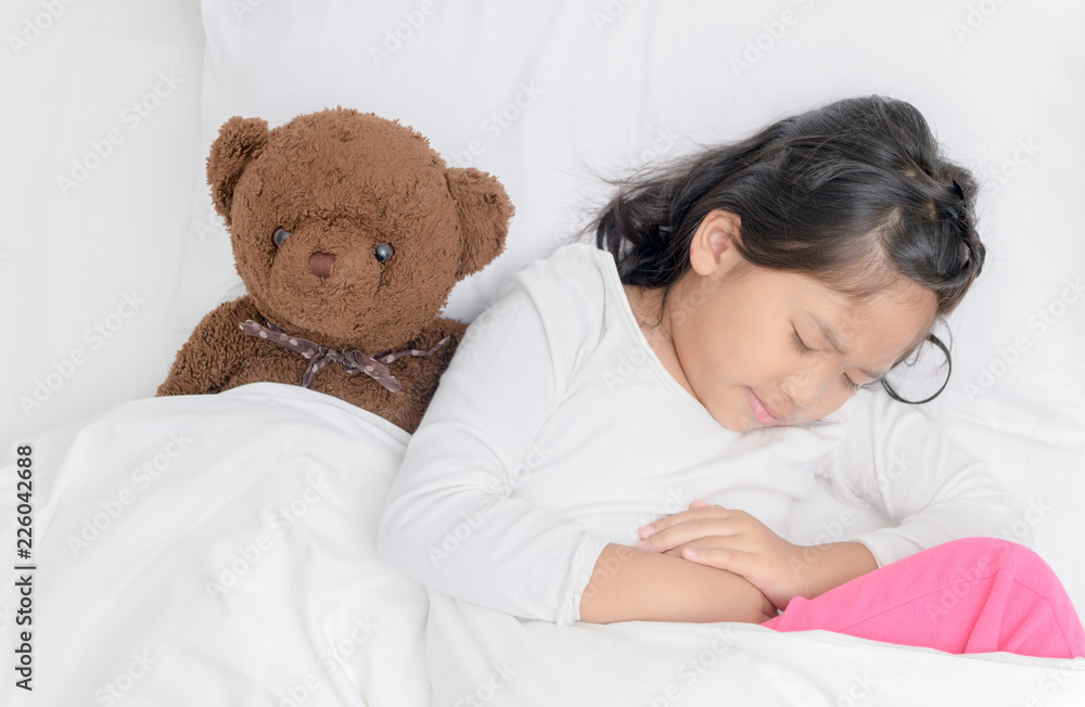 asian child suffering from stomachache asian child suffering from stomachache