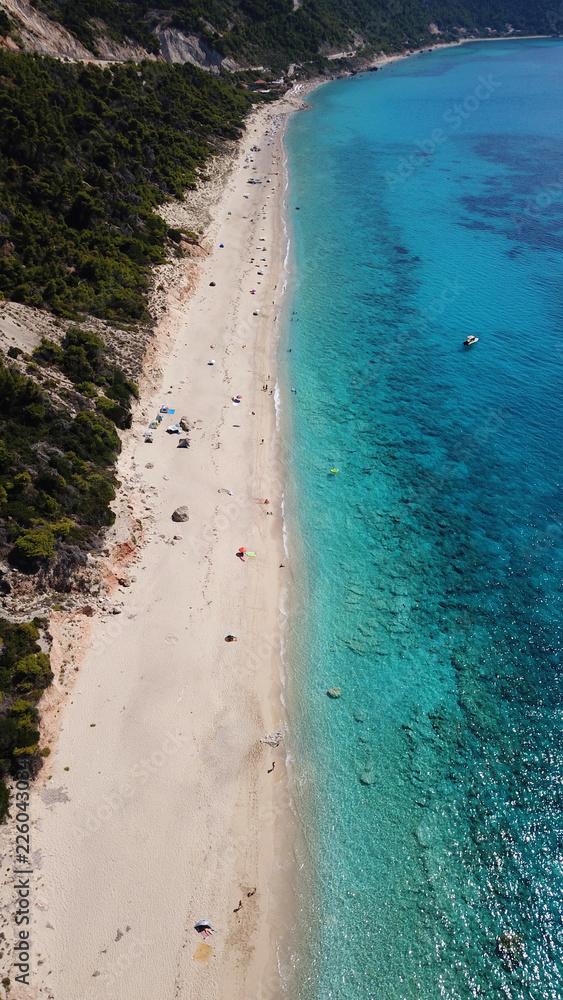 Fototapeta premium Aerial drone bird's eye view photo of small rocky beach next to iconic beach of Milos and Agios Nikitas in island of Lefkada, Ionian, Greece