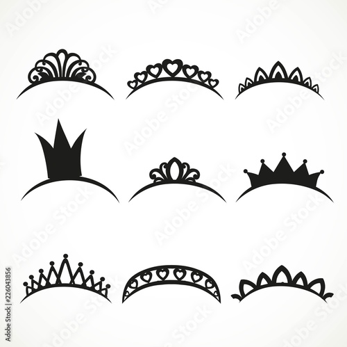 Set of black silhouettes of tiaras of various shapes on a white background