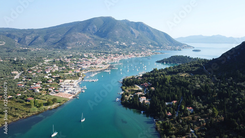 Aerial drone bird's eye view photo of iconic port of Nidri or Nydri a safe harbor for sail boats and famous for trips to Meganisi, Skorpios and other Ionian islands, Leflkada island, Ionian, Greece