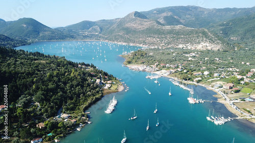 Aerial drone bird's eye view photo of iconic port of Nidri or Nydri a safe harbor for sail boats and famous for trips to Meganisi, Skorpios and other Ionian islands, Leflkada island, Ionian, Greece