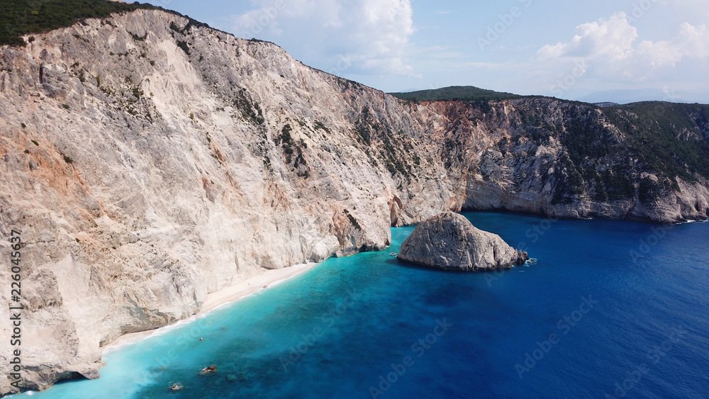 Aerial drone photo of popular tropical paradise deep turquoise beach of Porto Katsiki with white steep rocky seascape and beautiful cloudy landscape, Lefkada island, Ionian, Greece Aerial drone photo of popular tropical paradise deep turquoise beach of Porto Katsiki with white steep rocky seascape and beautiful cloudy landscape, Lefkada island, Ionian, Greece