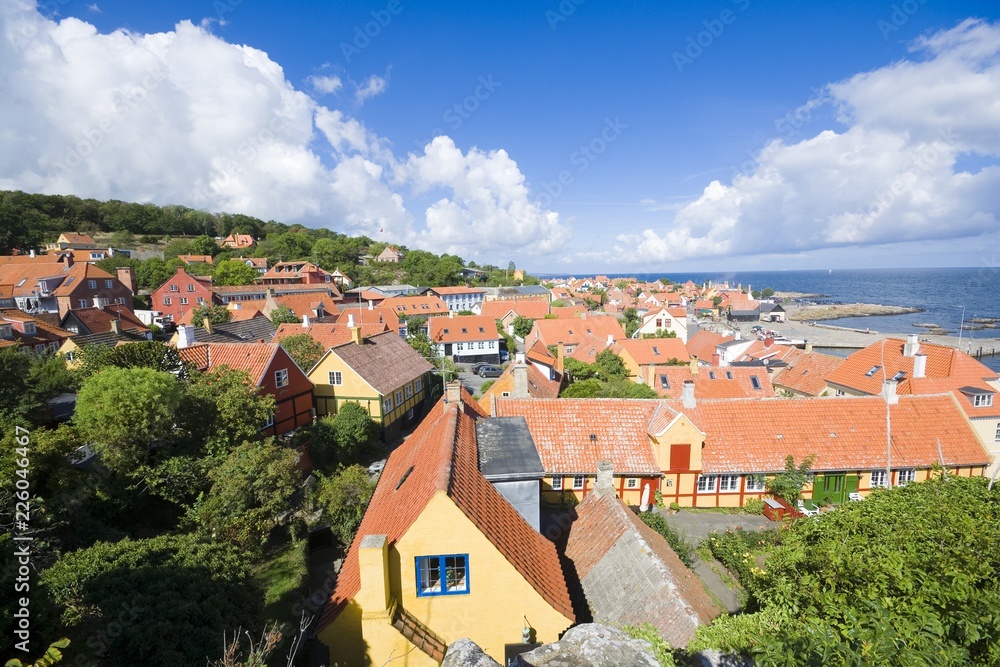 Aerial view of small town - with beautiful, small houses - at the seaside, Gudhjem, Bornholm, Denmark