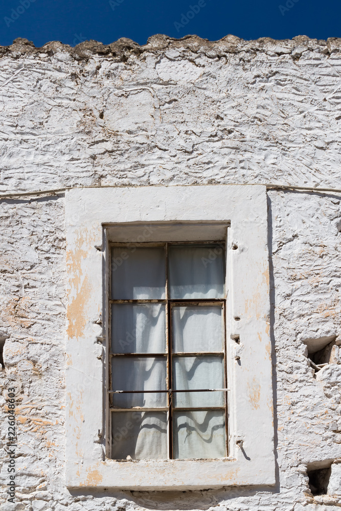 Window and a white stone wall, Greece Window and a white stone wall, Greece