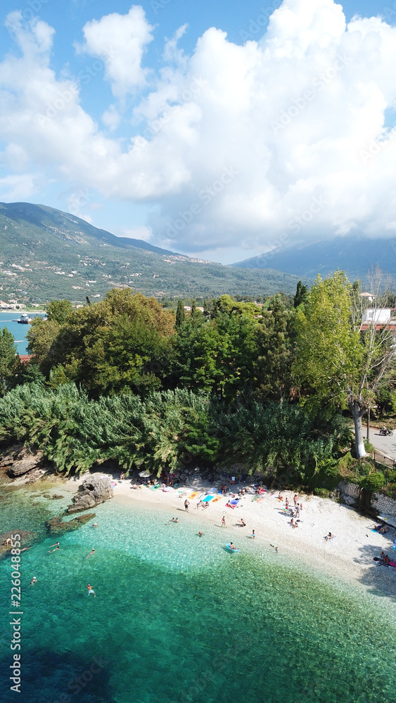 Fototapeta premium Aerial drone bird's eye view photo of iconic port of Nidri or Nydri a safe harbor for sail boats and famous for trips to Meganisi, Skorpios and other Ionian islands, Leflkada island, Ionian, Greece