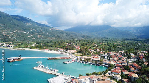 Aerial drone photo of famous seaside village and port of Vasiliki famous for trips to Ionian islands and nearby beaches, Lefkada, Greece
