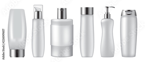 Set of cosmetic bottles on white background