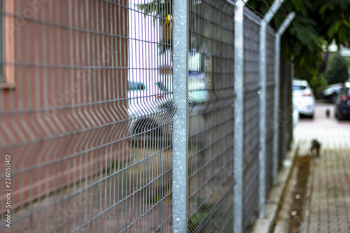 Perspective shoot of metal fences near walkline