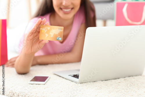 Young woman shopping online...