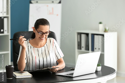 Young businesswoman working...