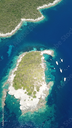 Aerial drone bird's eye view photo of iconic paradise sandy beaches with turquoise sea in complex islands of Agios Nikolaos and Mourtos in Sivota area, Ionian sea, Epirus, Greece