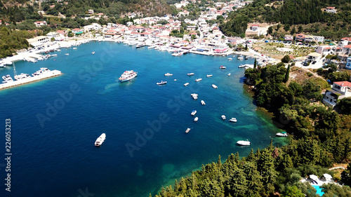 Aerial drone bird's eye view photo of famous village and port in bay of Sivota, Epirus, Greece