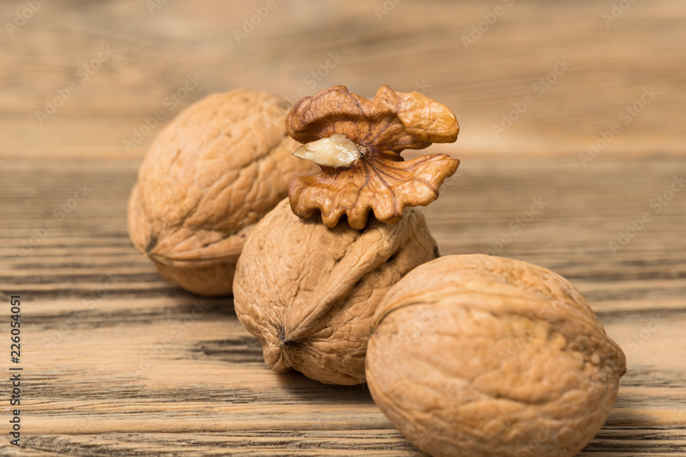 walnuts on wooden surface walnuts on wooden surface