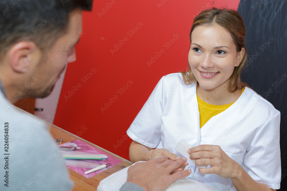 manicure specialist woman doing mail finger nail care manicure specialist woman doing mail finger nail care