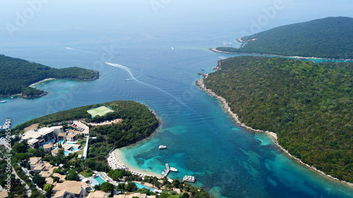 Aerial drone bird's eye view photo of iconic paradise sandy beaches with turquoise sea in complex islands of Agios Nikolaos and Mourtos in Sivota area, Ionian sea, Epirus, Greece