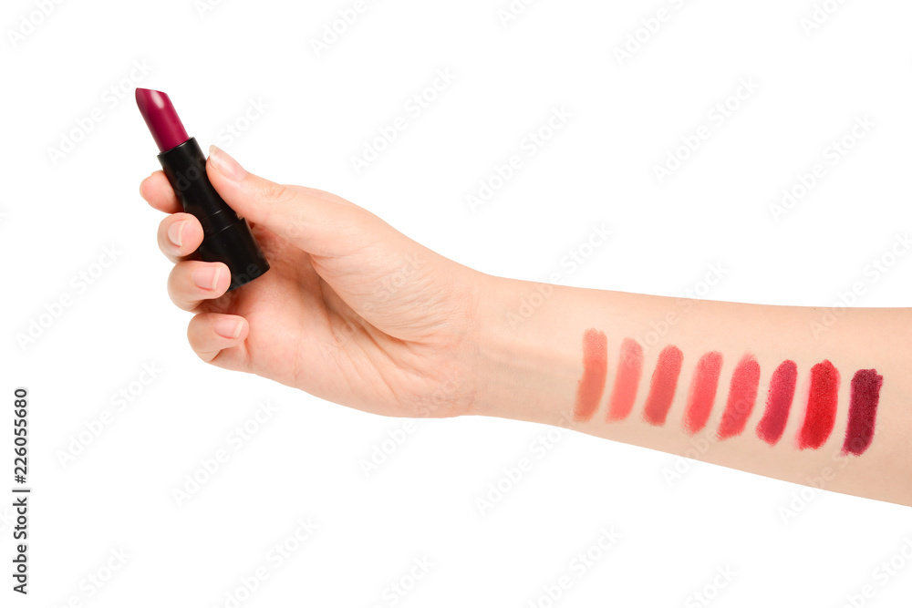 Lipstick swatches on woman hand isolated on white background. Lipstick swatches on woman hand isolated on white background.