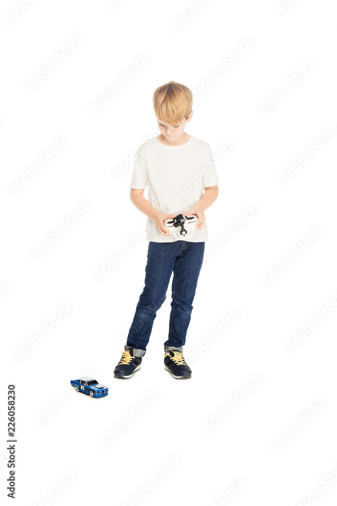 adorable boy playing with radio controlled car isolated on white adorable boy playing with radio controlled car isolated on white