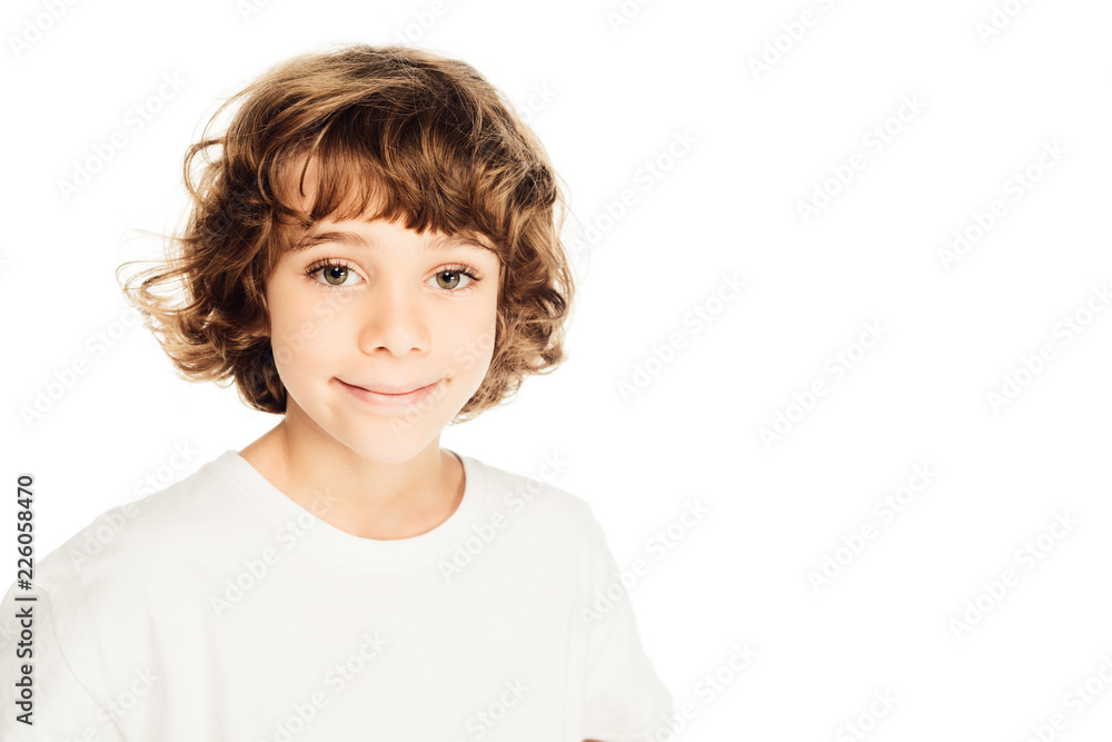 adorable cheerful boy with curly hair looking at camera isolated on white adorable cheerful boy with curly hair looking at camera isolated on white