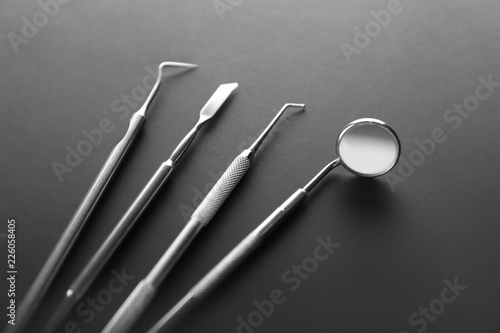 Dentist's tools on dark background