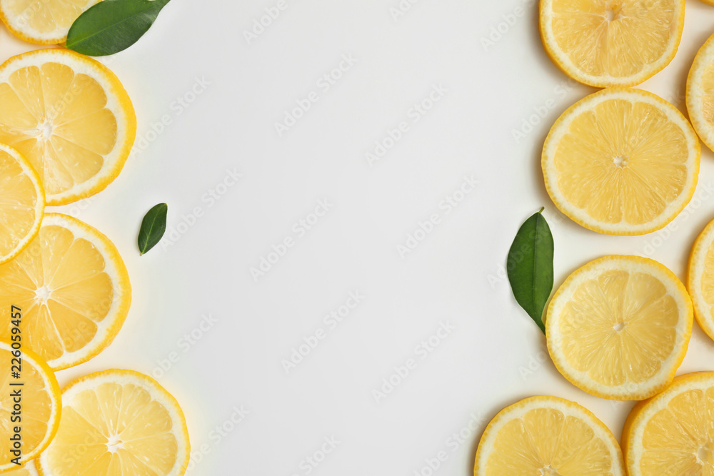 Composition with lemon slices and space for text on white background Composition with lemon slices and space for text on white background