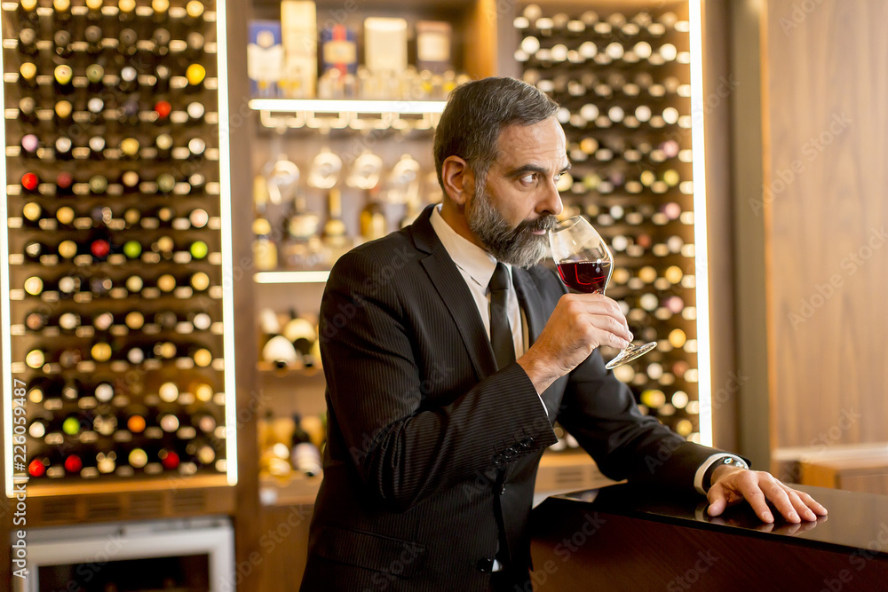 Senior handsome man drinking red wine Senior handsome man drinking red wine