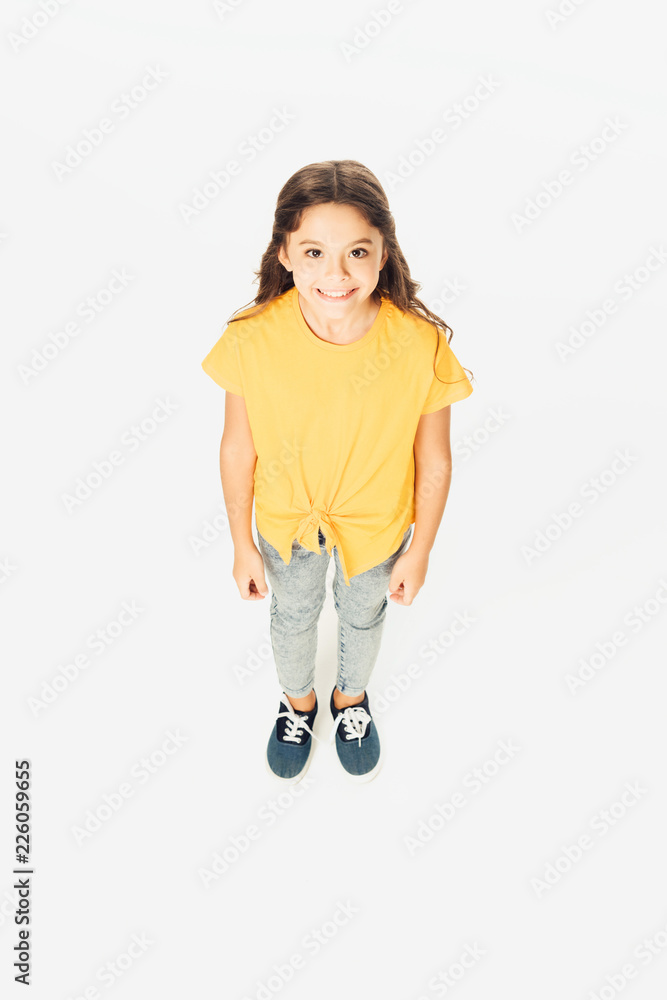 high angle view of adorable happy kid smiling at camera isolated on white high angle view of adorable happy kid smiling at camera isolated on white
