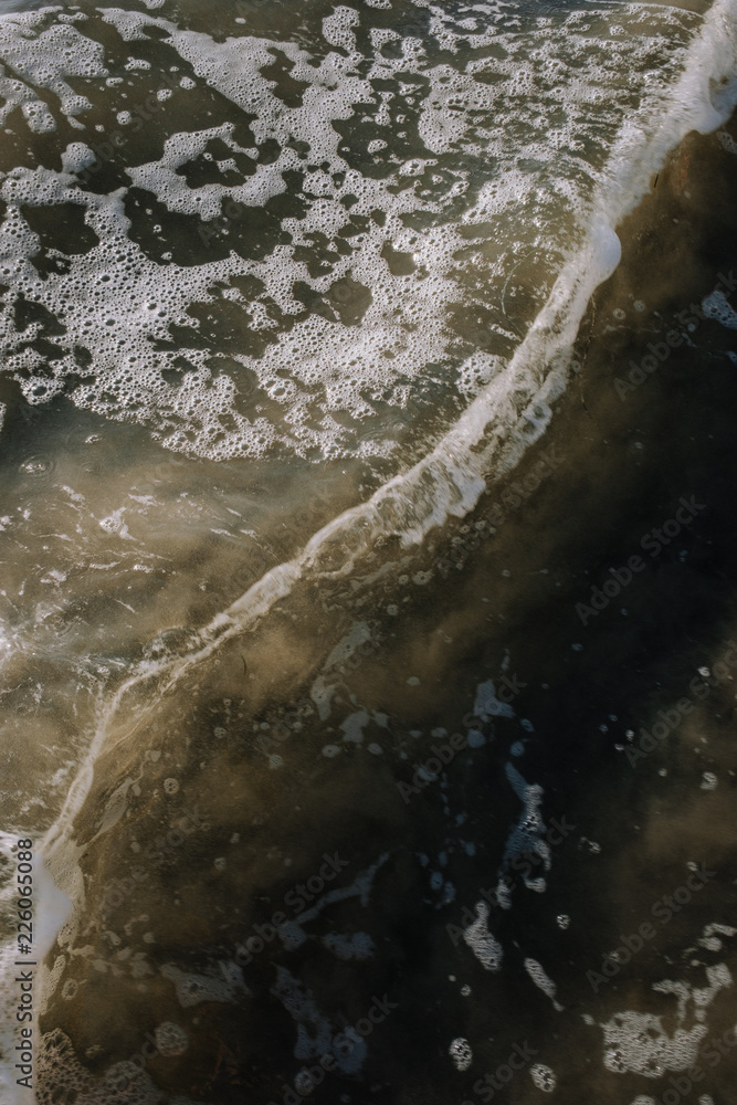 Waves Splashing Across a Beach Waves Splashing Across a Beach