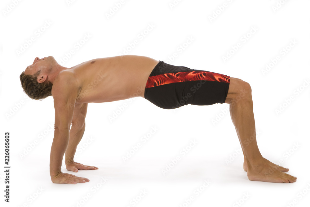 Handsome young man practicing yoga exercise Handsome young man practicing yoga exercise