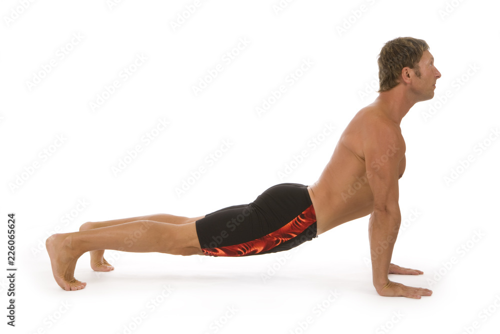 Handsome young man practicing yoga exercise Handsome young man practicing yoga exercise