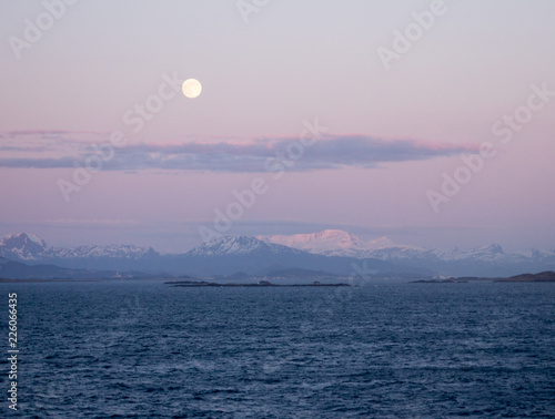 Moonlit sea and hills. Cruising beyond the Fford north of Hovden island and south of Kalvag. photo