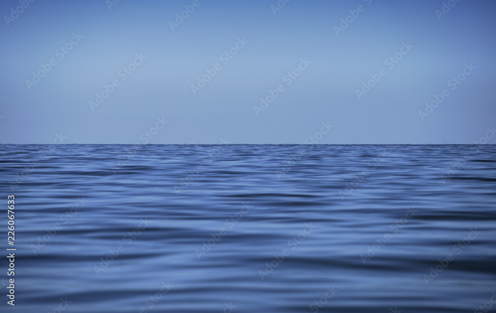Obraz premium Blue sea and blue sky background
