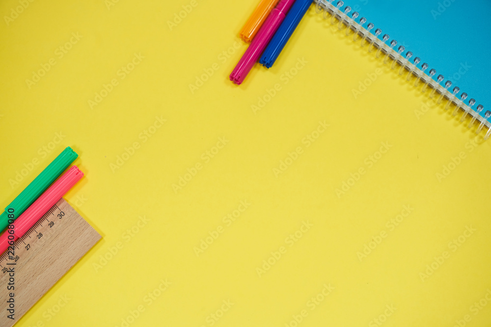office equipments on yellow background office equipments on yellow background