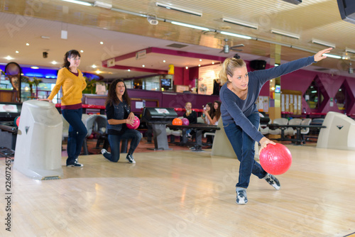 woman playing bowling