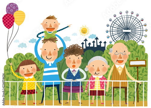 Portrait of large family in front of amusement park