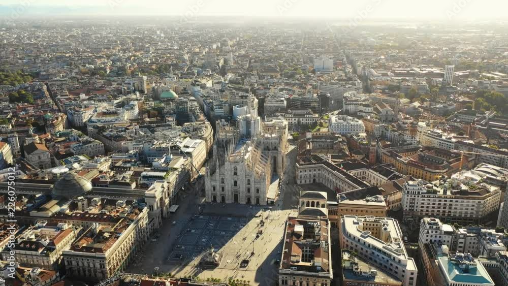 Aerial panoramic view of cityscape of Milan, historic part of city with gothic Milan Cathedral, landscape panorama of Italy from above, Europe