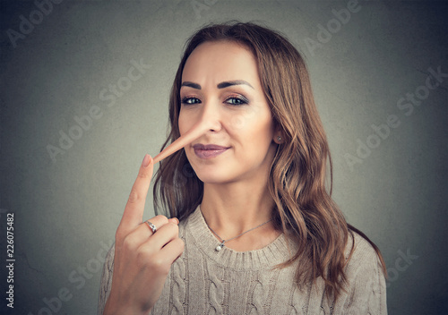 Canvas Print A liar woman with long nose
