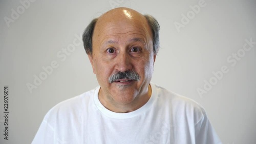 happy sad confused depressed angry facial emotion expression of senior 60 70 year old man on isolated grey background in face expressions concept.